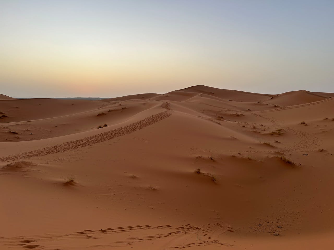 Captivating view of Morocco's Sahara desert dunes at twilight.