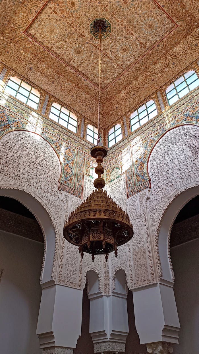 Explore the exquisite Islamic architecture and mosaic art of Meknès, Morocco, captured in this stunning palace interior.